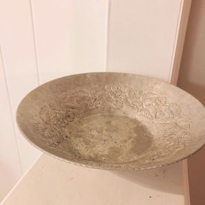 Hand forged metal bowl with floral detail